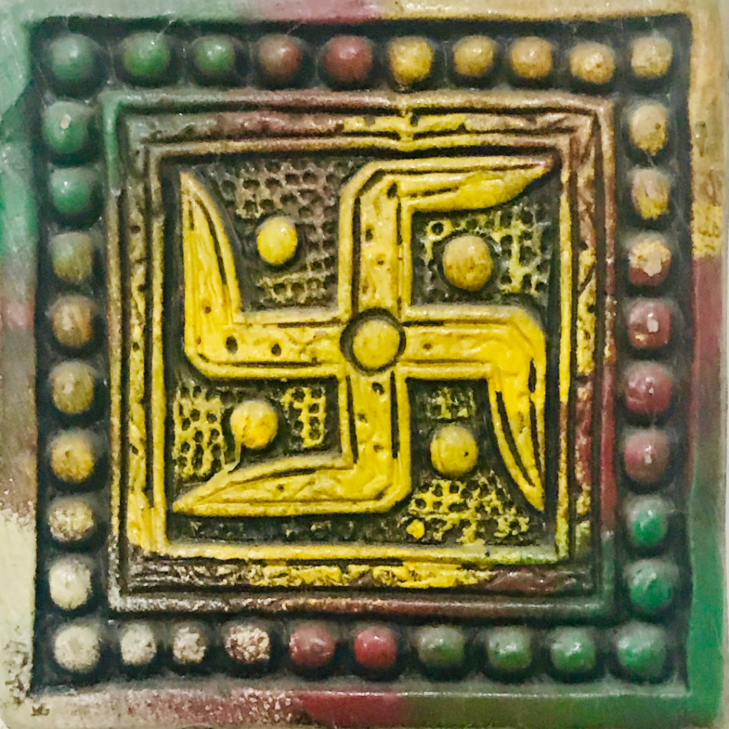 swastika symbol associated with Litha